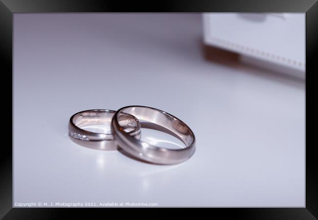wedding rings isolated on white Framed Print by M. J. Photography