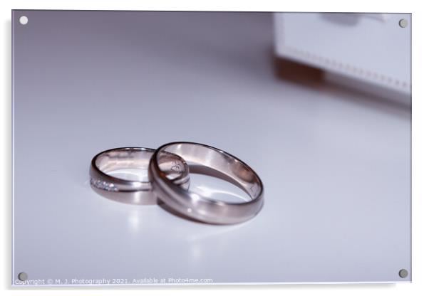 wedding rings isolated on white Acrylic by M. J. Photography