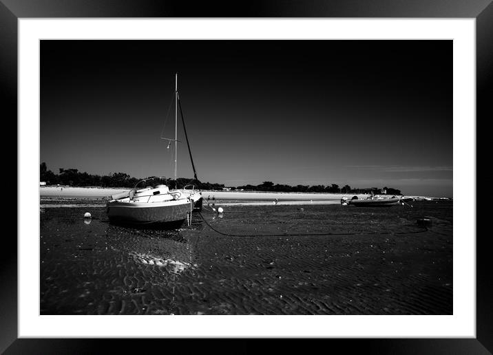 boats laying on the beach in blackwhite Framed Mounted Print by youri Mahieu