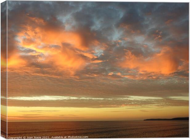 Spectacular red clouds at sunset in North Devon Canvas Print by Joan Rosie