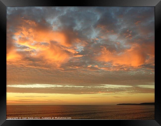 Spectacular red clouds at sunset in North Devon Framed Print by Joan Rosie