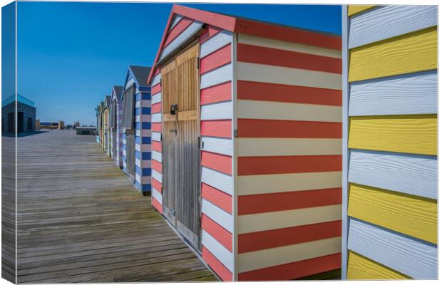 Huts on the pier. Canvas Print by Bill Allsopp