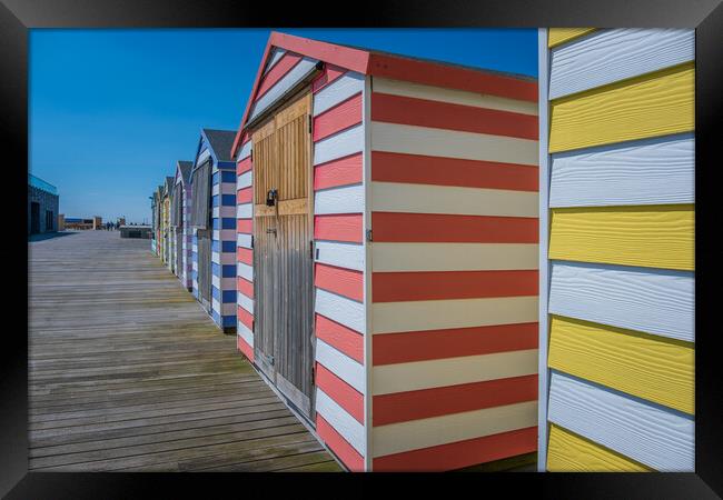 Huts on the pier. Framed Print by Bill Allsopp