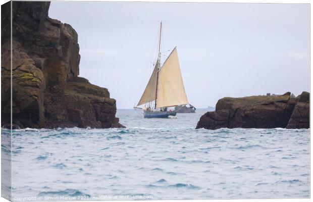 Yacht sailing between rocks in the Isles of Scilly Canvas Print by Simon Marlow