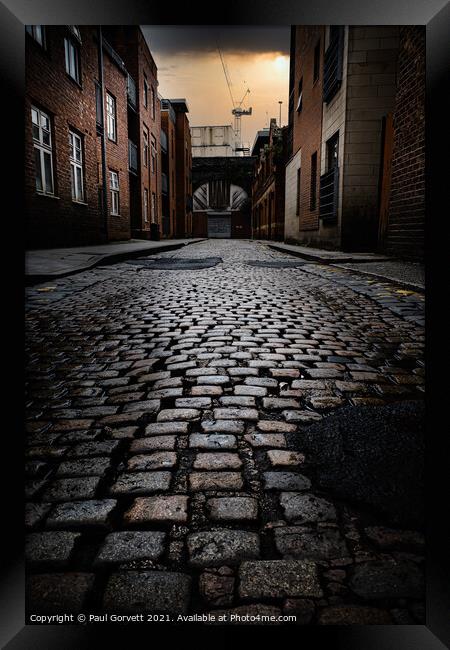 wet cobbled street in Manchester city center UK Framed Print by Paul Gorvett