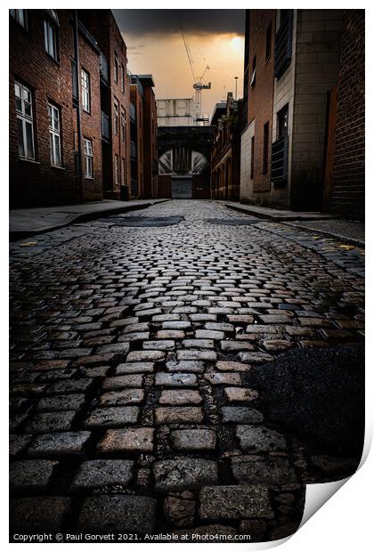 wet cobbled street in Manchester city center UK Print by Paul Gorvett