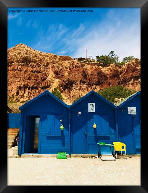 Colourful Beach Huts on Algarves Golden Cliffs Framed Print by Chris Mc Manus