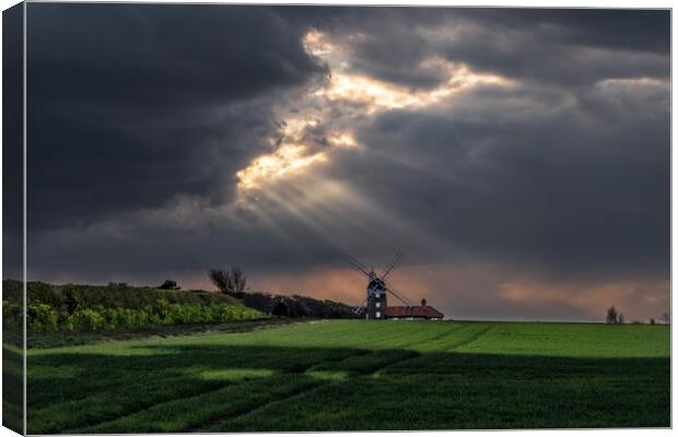 Sun rays over Weybourne mill  Canvas Print by Gary Pearson