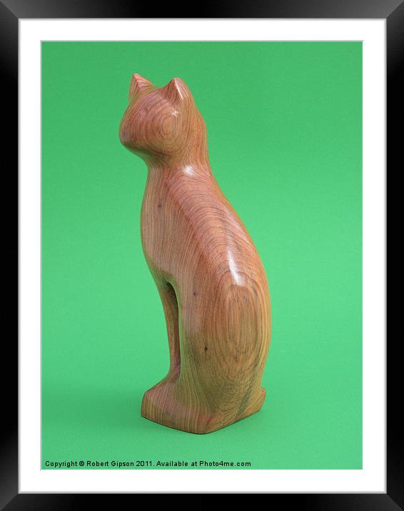 Carved wooden Cat on green Framed Mounted Print by Robert Gipson