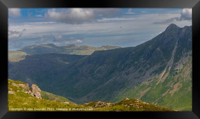 Langdale Pikes and beyond Framed Print by Alan Dunnett