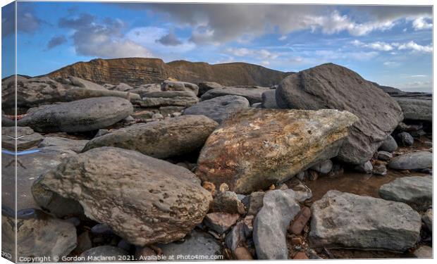 Rocks on Monknash Beach Canvas Print by Gordon Maclaren