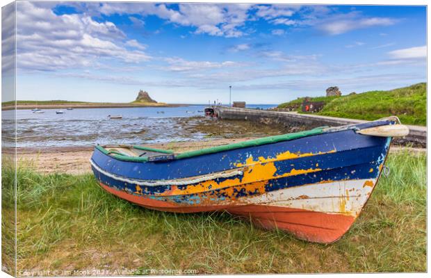 Old boat at Holy Island Canvas Print by Jim Monk