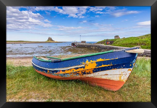 Old boat at Holy Island Framed Print by Jim Monk