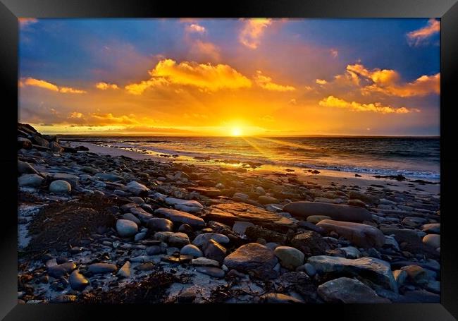 Sunset on the rocky beach Framed Print by Myles Campbell