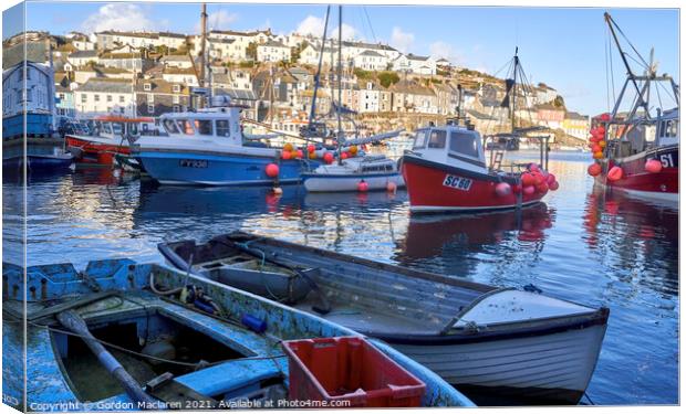 Fishing boats and sailing boats moored in Mevagissey Harbour, Cornwall.  Canvas Print by Gordon Maclaren