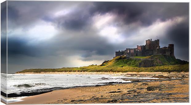 Stormy sky over Bamburgh Castle Canvas Print by Kevin Tate