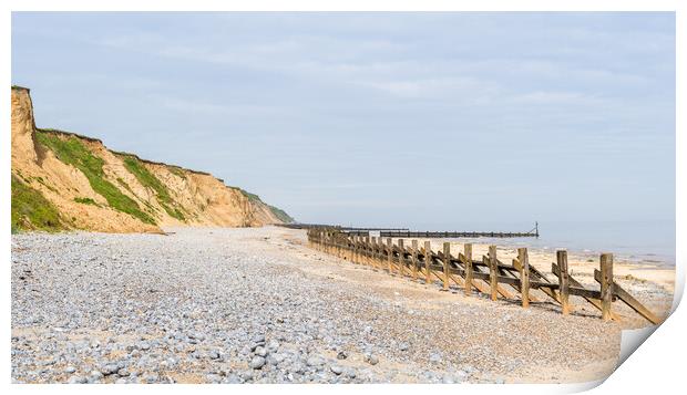 Pebbles and sea defences at West Runton beach Print by Jason Wells