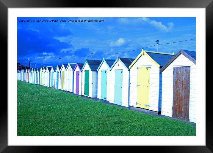 Coloured wooden beach huts in Paignton, Devon Framed Mounted Print by SIMON STAPLEY