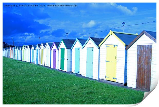 Coloured wooden beach huts in Paignton, Devon Print by SIMON STAPLEY