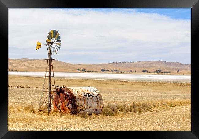 Wind wheel and water tank - South Australia Framed Print by Laszlo Konya