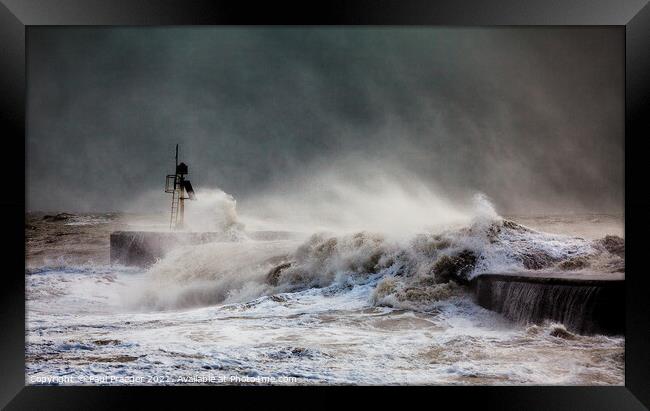 Storm waves breaking over the harbour arm at Hastings  Framed Print by Paul Praeger