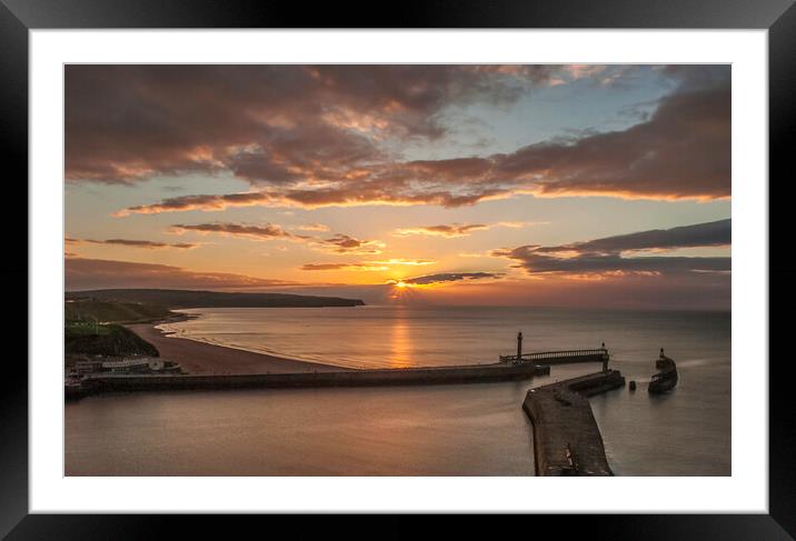 Sunset over Whitby piers Framed Mounted Print by Andrew Sharpe