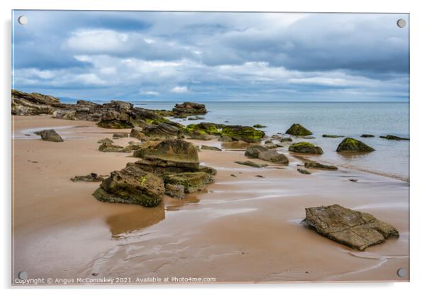 Rocks on Dornoch beach in Sutherland, Scotland Acrylic by Angus McComiskey