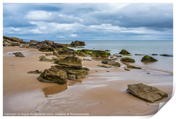 Rocks on Dornoch beach in Sutherland, Scotland Print by Angus McComiskey