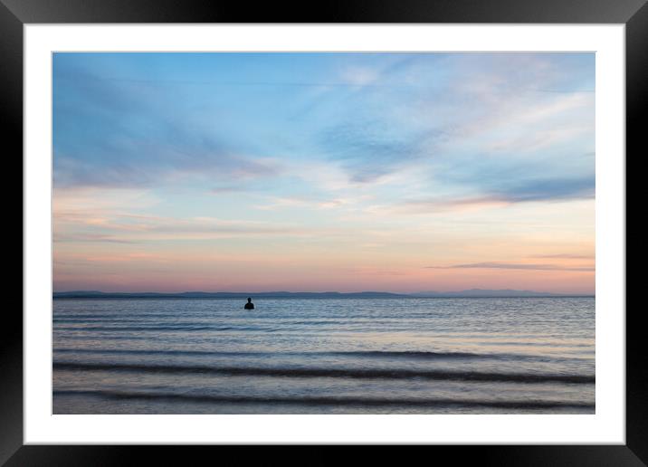 Iron Man under a colourful sky at sunset Framed Mounted Print by Jason Wells