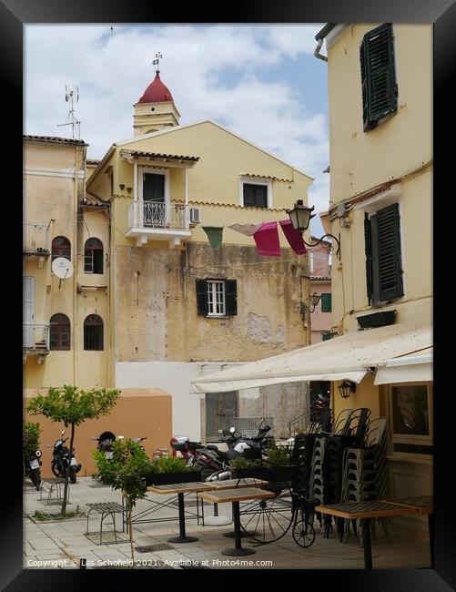 Square in Corfu town  Framed Print by Les Schofield