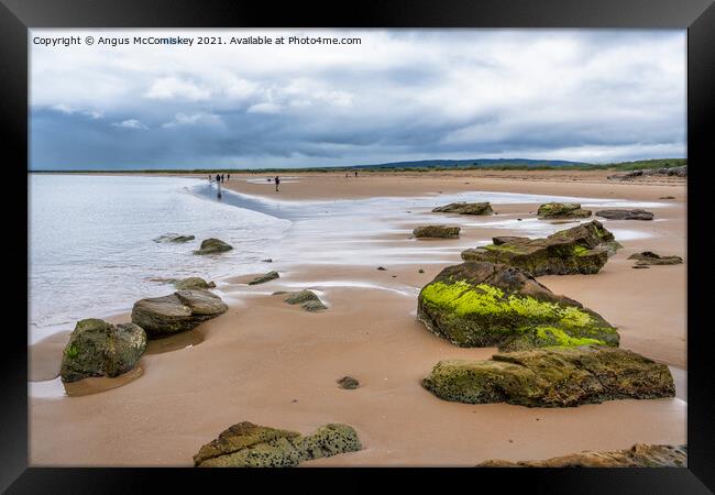 Dornoch beach looking south as the tide retreats Framed Print by Angus McComiskey