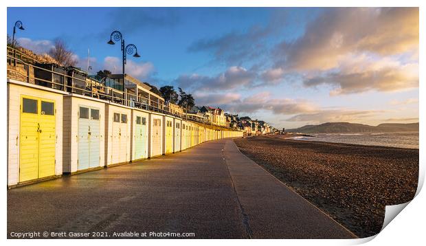 Beach Hut Sunrise in Lyme Regis Print by Brett Gasser