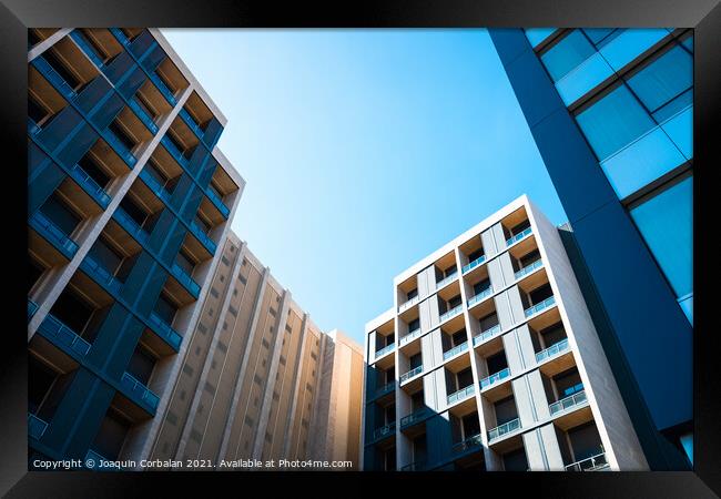 Residential buildings in a quiet neighborhood with high purchasi Framed Print by Joaquin Corbalan