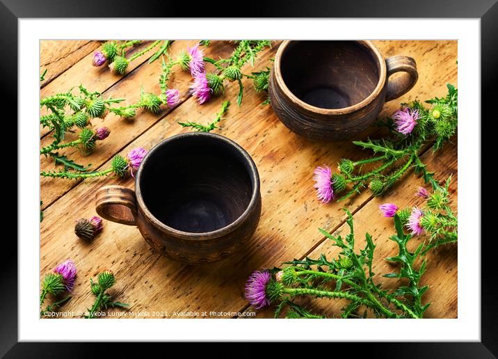 Thistle in herbal medicine Framed Mounted Print by Mykola Lunov Mykola