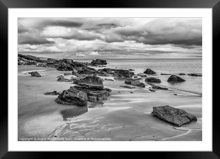 Rocks on Dornoch beach mono Framed Mounted Print by Angus McComiskey