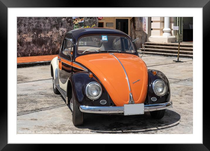 Black and orange vintage Volkswagen Beetle Framed Mounted Print by Kevin Hellon