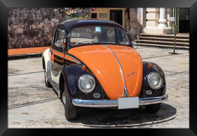 Black and orange vintage Volkswagen Beetle Framed Print by Kevin Hellon