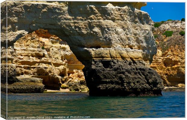 Arch of Marinha Beach and Cliffs Canvas Print by Angelo DeVal