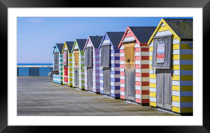 Beach Huts on Hastings pier. Framed Mounted Print by Bill Allsopp