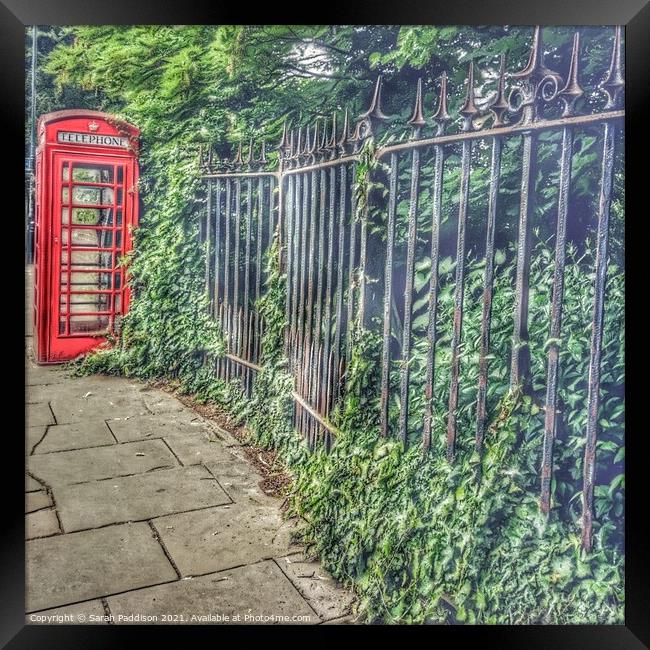 Phone box and Fence Framed Print by Sarah Paddison