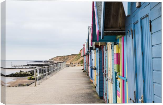 Beach huts on the promenade at Sheringham Canvas Print by Jason Wells