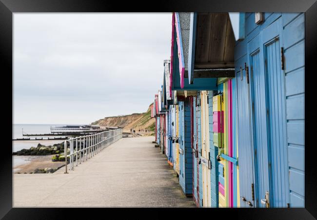 Beach huts on the promenade at Sheringham Framed Print by Jason Wells
