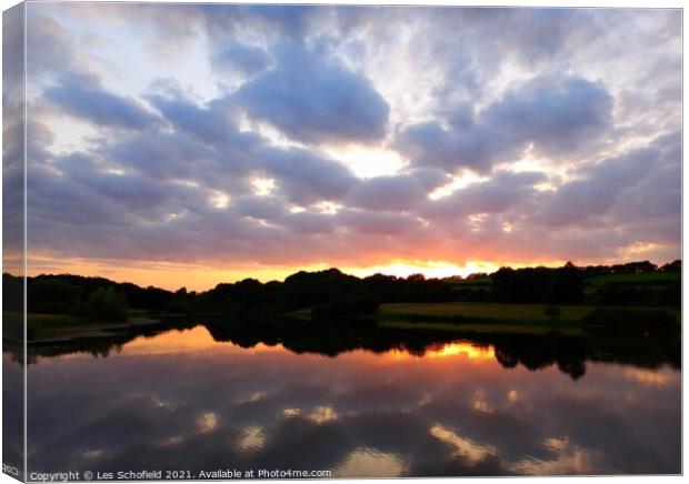 Sunset reflection  Canvas Print by Les Schofield