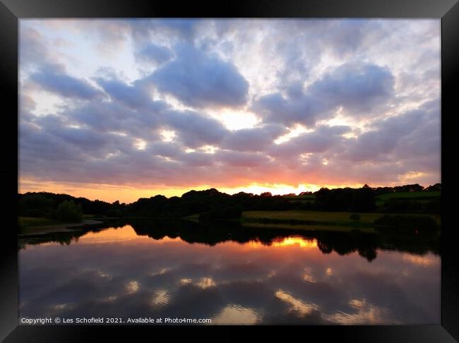 Sunset reflection  Framed Print by Les Schofield