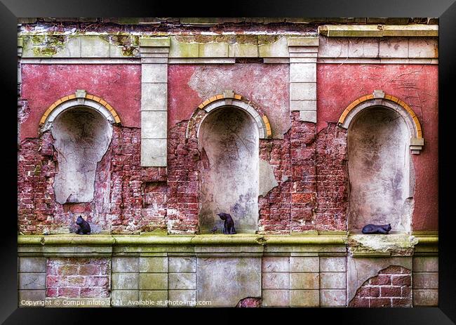 old wall containing statues of cats Framed Print by Chris Willemsen