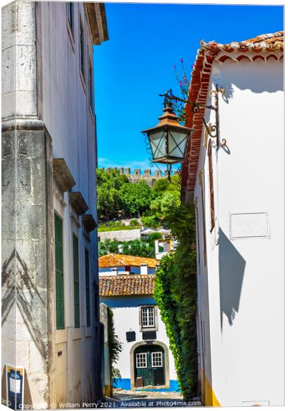 Narrow White Street 11th Century Castle Wall  Obidos Portugal Canvas Print by William Perry