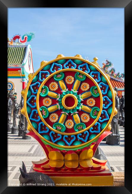the Buddhist Dharma wheel known as that Wheel of teaching Framed Print by Wilfried Strang