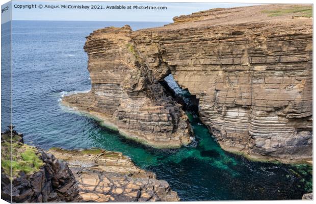 Rock arch near Brough of Bigging, Orkney Mainland Canvas Print by Angus McComiskey