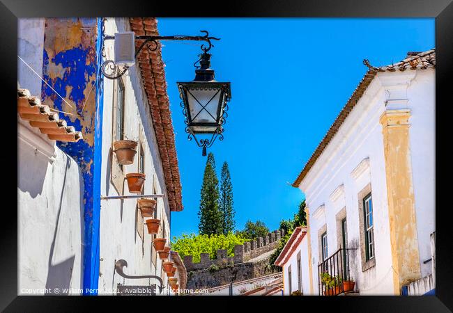 Narrow White Street 11th Century Castle Wall  Lamp Obidos Portug Framed Print by William Perry