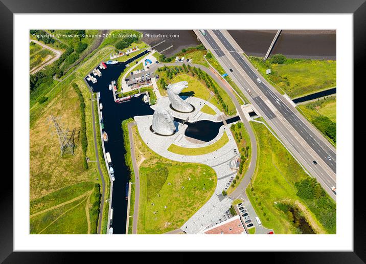 The Kelpies from the air Framed Mounted Print by Howard Kennedy